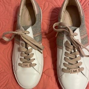 Michael Kors sneakers size 8 1/2 very pretty and fashionable.